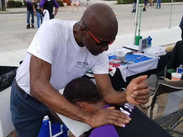 African American Male Receiving A Chair Massage
