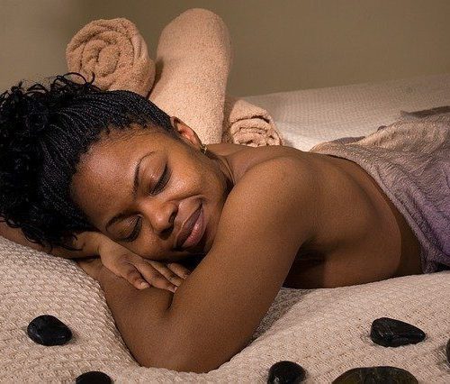 African American Woman Lying On Stomach, Relaxed