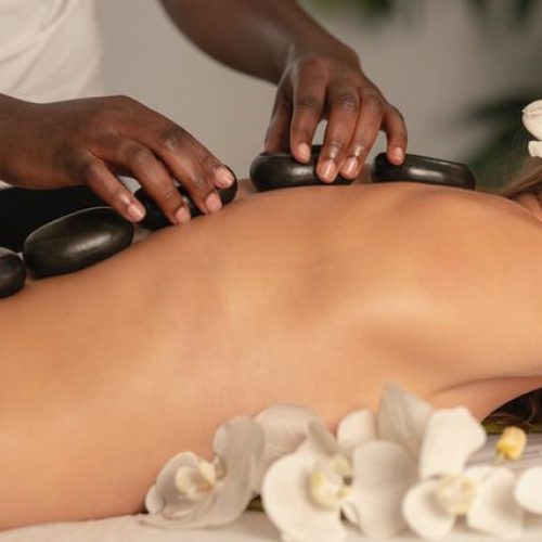Woman Getting Hot Stones Placed On Her Back